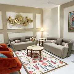 For this South Mumbai residence, we crafted a living space that balances contemporary elegance with inviting warmth. The custom rug, plush upholstery in terracotta and taupe, and curated wall art create a sophisticated yet comfortable family haven.