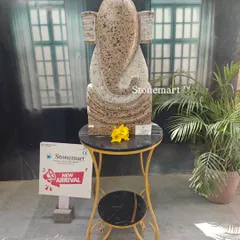 A full view of the 21-inch modern abstract Ganesha sculpture in speckled granite. This piece is hand-carved and designed to be a focal point in a contemporary home or garden setting.