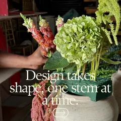 Design takes shape, one stem at a time. Here, one of our floral artists is building a large arrangement, carefully placing each flower to create a balanced and beautiful composition.