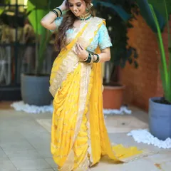Another shot of the beautiful yellow Nauvari saree. The hairstyle is simple and elegant, allowing the intricate outfit to be the star.