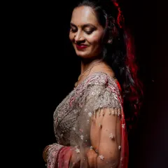 A dramatic and artistic portrait of a bride at her reception. My photography team excels at capturing stunning, high-fashion-inspired shots.