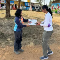 We conclude our treks by recognizing participants' efforts. Here, a trekker receives her completion certificate from one of our outdoor leaders.