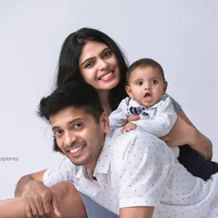 A happy family portrait with a clean and classic white background. This style puts all the focus on your family's bright smiles and loving interactions.