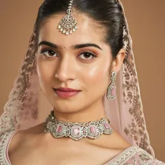 A closer look at this soft glam bridal makeup. Notice how the subtle pink tones on the eyes and cheeks harmonize with the jewelry, creating a cohesive and polished look.