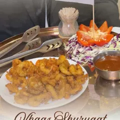 A 'Khaas Shuruaat' or special beginning, with a platter of Golden Fried Prawns. This dish is a favourite for its crispy texture and succulent flavour, making it a standout appetizer.