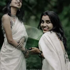 An artistic portrait using a double exposure effect with a large banana leaf. This creative technique adds a dreamy, ethereal quality to the image.