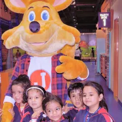 Students from a school group get to meet and take pictures with our mascot, J the Fox.