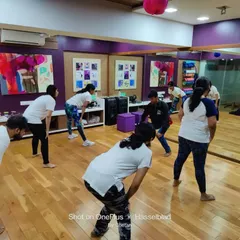 A group of women learning warm-up and conditioning exercises essential for self-defense. Our sessions are designed to be engaging and practical, ensuring everyone can participate regardless of their fitness level.
