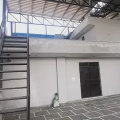 The rooftop access area of the commercial building prior to panel installation. We conduct thorough site evaluations to plan the most effective and safe installation strategy for every project.