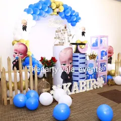 This Boss Baby theme for a first birthday features a balloon arch, themed pedestals, and "BABY" blocks. The blue, white, and gold color scheme is a popular and classic choice.