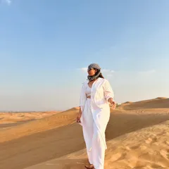 Walking on the golden dunes. The all-white linen outfit from Westside is perfect for staying cool in the desert heat while looking effortlessly chic.