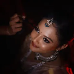 A close-up of the magic. This shot highlights the detailed eye makeup and the dewy, glossy skin finish I aim for. My goal is to make your features pop without feeling heavy, ensuring you look perfect both in person and on camera.