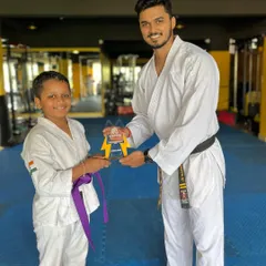 Presenting the "Best Student of the Year" award. This recognizes not just skill, but also discipline, respect, and consistent effort.