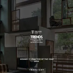 A graphic celebrating our 'Practice of the Year 2024' win at the Trends Excellence Awards, overlaid on a moody interior shot of the Magari showroom we designed.