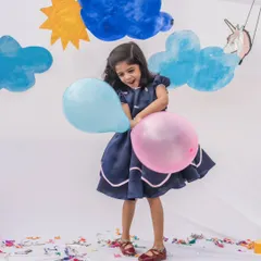 A classic navy blue dress designed for timeless elegance. The puff sleeves and delicate pink piping detail give it a sophisticated charm, making it perfect for formal parties or family gatherings.