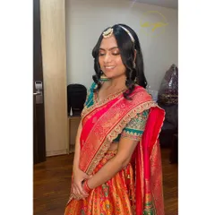 Mehendi vibes for this lovely client. The makeup is subtle and glowing, paired with a simple open hairstyle and a matha patti for a touch of tradition.