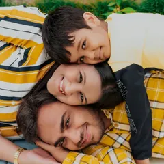 Family photos should be fun, not formal. I love capturing genuine connection, like this playful family stack, which shows their unique bond and happy energy during our outdoor session.