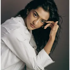 A softer, more thoughtful portrait from the same series. Showing a range of expressions is key for a strong model book.