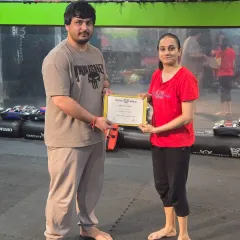 Presenting a certificate of completion. This piece of paper represents hours of sweat, discipline, and the acquisition of real skills.