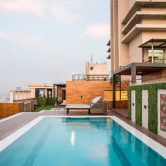 I believe a home should be a retreat, and this penthouse rooftop is the ultimate urban oasis. I designed this space with a pool, custom decking, and comfortable lounge areas to be perfect for both quiet relaxation and entertaining guests against the city skyline.