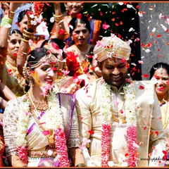 A joyous exit as the newlyweds are showered with flower petals by their loved ones. This shot is full of color, movement, and happiness.