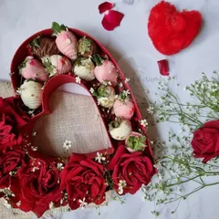 My heart-shaped box filled with fresh, juicy strawberries hand-dipped in pink and white chocolate. It's a beautiful and delicious alternative to a traditional box of chocolates.