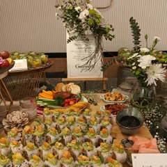 Our Gold Dragon Sushi rolls are a testament to our love for Asian cuisine. This beautifully arranged platter, complete with fresh flowers and elegant branding, showcases how we transform event catering into a sophisticated culinary experience.