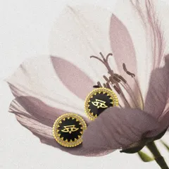 A creative shot of the Chevron Studs by JJ Valaya, nestled in a delicate flower. These studs are perfect for adding a touch of designer elegance to your daily wardrobe.