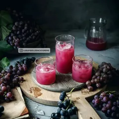 Freshly prepared Grape Juice served over ice. We use high-quality fruits to create natural and flavorful juices for our beverage menu.
