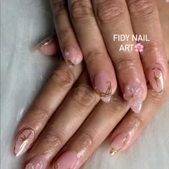 A closer look at FiDi nail art. These delicate, translucent flowers are sculpted directly onto the nail, paired with fine gold line work for an ethereal look.
