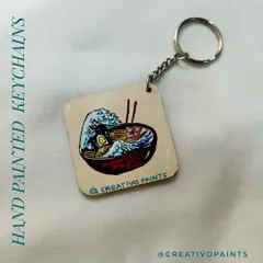 This keychain combines two great things: ramen and classic Japanese art. I painted a delicious-looking ramen bowl with a background inspired by Hokusai's "The Great Wave," a perfect custom gift for a foodie.