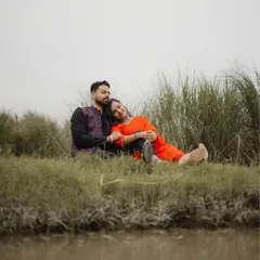 A peaceful moment by the water, reflecting the tranquility of their relationship. Natural settings provide a beautiful canvas for authentic couple portraits.