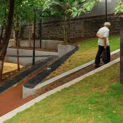 **Nepean Greens, Mumbai:** Accessibility was a key consideration. We designed a continuous, gently sloping ramp alongside the steps to ensure the plaza is welcoming and usable for the elderly and people with disabilities, connecting two streets at different levels.