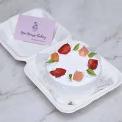 A fresh mixed fruit bento cake, topped with strawberries and other seasonal fruits. It's a light and refreshing option for a sweet treat.