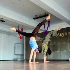 Evenings at Aayana. Two of our instructors practicing handstands together, supporting and inspiring each other.