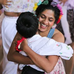 A joyful hug between a student and their mother. Our studio is a place where these warm, heartfelt connections are celebrated.