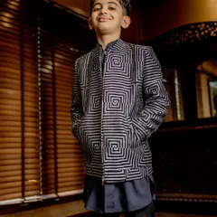 This geometric print bomber jacket is a true vibe. Paired with a simple kurta, it creates a sharp, contemporary fusion look for any festive occasion.