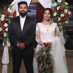 A beautiful portrait of a bride and groom from a Christian wedding. Her makeup is soft and natural, allowing her happiness to be the main focus.