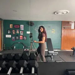 Just me, posing and flexing in my favorite place. This gym is my sanctuary, the place where I build my own strength and find my focus.