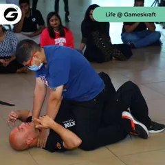 This is a ground survival drill in an office environment. We simulate real-world attacks to prepare employees for the worst-case scenario, teaching them how to protect themselves even when overpowered.
