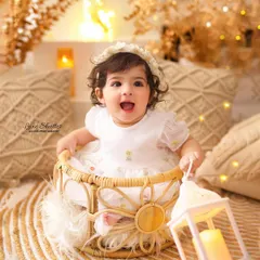 Pure joy and excitement! This little princess is having the best time in our warm and cozy boho-themed first birthday setup.