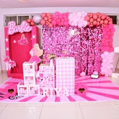 A vibrant and playful Barbie-themed first birthday party. We used shades of pink, a sparkling sequin backdrop, and a life-sized Barbie box prop to create a fun and glamorous world for the birthday girl.