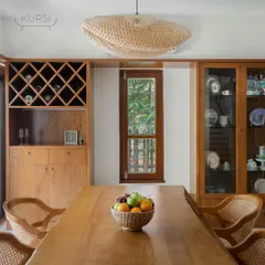 The dining table is the heart of many homes. This setting features one of my signature live-edge teak tables, paired with classic rattan dining chairs. The natural edge of the wood means every table is unique, bringing organic warmth to your meals.