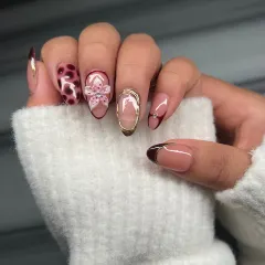A side view of the hand-painted floral and tortoiseshell set. I love combining different patterns and textures to create a manicure that is full of personality.