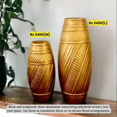 Sleek and sculptural, these aluminium vases bring industrial artistry into your space. I love using them as standalone decor or with tall floral arrangements. They are available in two sizes.