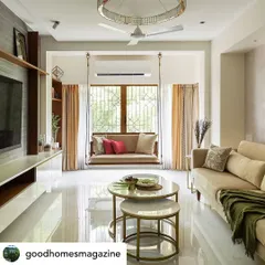 A full view of the living area, showcasing the balance between the plush sofa and the airy swing. The entire home is tied together by a soothing aesthetic and a subtle color palette.