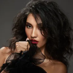 Here you can see the complete effect of the bold red lip and voluminous hair. This timeless combination is perfect for making a statement at any special occasion, from a cocktail party to a formal event.