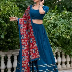 For a more modern and elegant look, this solid blue chaniya choli is perfect. It’s paired with a beautiful printed dupatta featuring traditional motifs, giving you a unique style that stands out from the crowd.