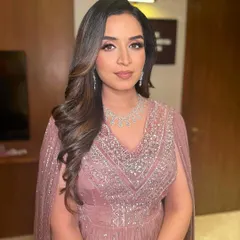 Nikita looks absolutely radiant. The makeup is designed to be photogenic and make her feel her best.