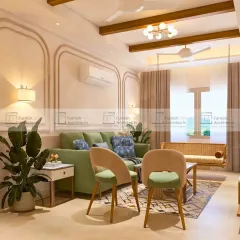 This angle highlights the wall molding and the soft, ambient lighting from the wall sconces. These details add a layer of classic charm to the otherwise modern living room, creating a timeless feel.